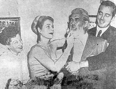 “Ouch! Careful with that comb!” Gabby Hayes exclaims as Mary Beth Hughes primps while John Payne holds on and Helen Forrest watches. The foursome were in San Antonio, TX for the premiere of “El Paso” at the Majestic Theatre.