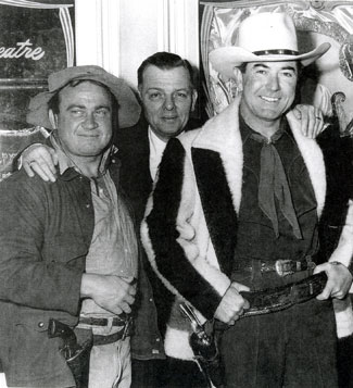 Dub “Cannonball” Taylor and Johnny Mack Brown, wearing a Hudson Bay coat, are ready for a movie theatre appearance with the local owner. (Photo courtesy Cynthia Hale.) 