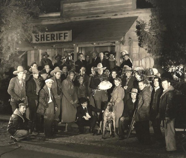 Buck Jones celebrates a birthday with the cast and crew of “Left-Handed Law” (‘37 Universal). (Thanx to Tinsley Yarbrough.) 