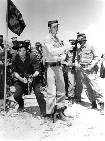 Have Machine Gun Will Travel. Richard Boone trades in his six-gun for a publicity shot with the U.S. Marines.