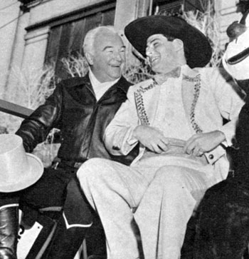 Hopalong Cassidy and singer Eddie Fisher swapped hats while riding in Macy’s annual Christmas parade in 1953.