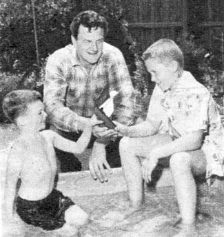 “Gunsmoke” star James Arness at home with his young sons Rolf and Craig. Circa Summer ‘57.