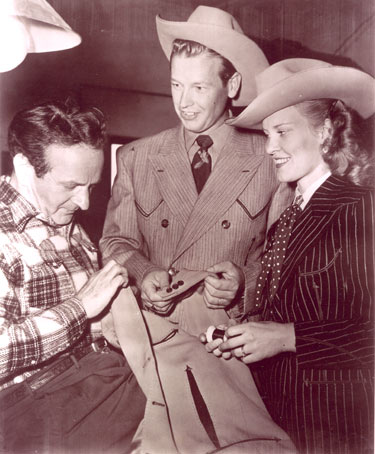 Rex Allen and his wife Bonnie check out a new Nudie suit at Nudie’s N. Hollywood tailor shop.