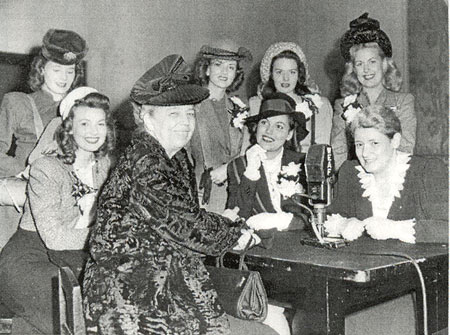 1946 photo of Eleanor Roosevelt with the Goldwyn Girls during a publicity tour for the movie "The Kid From Brooklyn". B-western actress Virginia Belmont is in the back center, hat on, directly behind Mrs. Roosevelt. The only other ID'd girl is Shirley Ballard at the bottom left. Can anyone ID any of the other ladies? Belmont co-starred in B-westerns with Johnny Mack Brown, Jimmy Wakely, Hopalong Cassidy and in the serial "Dangers of the Canadian Mounted" ('48).