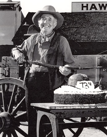 Walter Brennan jokingly celebrates his 73rd birthday on the set of his series "The Guns of Will Sonnett". (Photo courtesy Neil Summers.)
