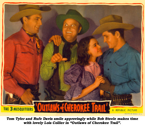 Tom Tyler and Rufe Davis smile approvingly while Bob Steele makes time with lovely Lois Collier in "Outlaws of Cherokee Trail".