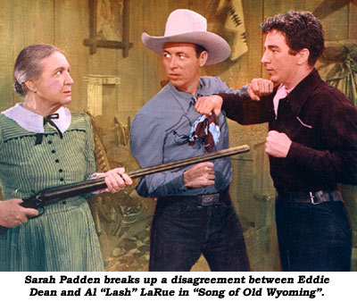 Sarah Padden breaks up a disagreement between Eddie Dean and Al "Lash" LaRue in "Song of Old Wyoming".