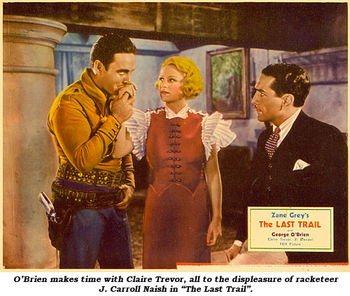 O'Brien makes time with Claire Trevor, all to the displeasure of racketeer J. Carroll Naish in "The Last Trail".