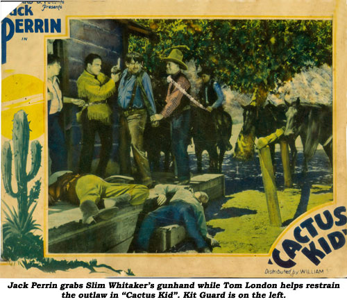 Jack Perrin grabs Slim Whitaker's gunhand while Tom London helps restrain the outlaw in "Cactus Kid". Kit Guard is on the left.