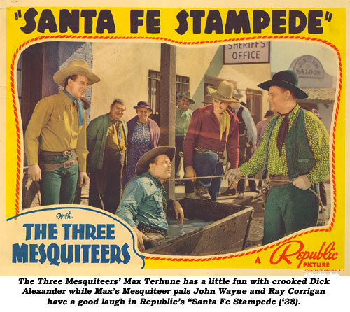 The three Mesquiteers' Max Terhune has a little fun with crooked Dick Alexander while Max's Mesquiteer pals John Wayne and Ray Corrigan have a good laugh in Republic's "Santa Fe Stampede" ('38).