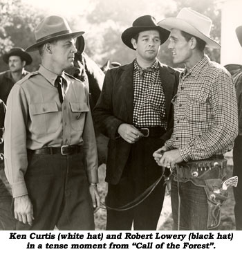 Ken Curtis (white hat) and Robert Lowery (black hat) in a tense moment from "Call of the Forest".