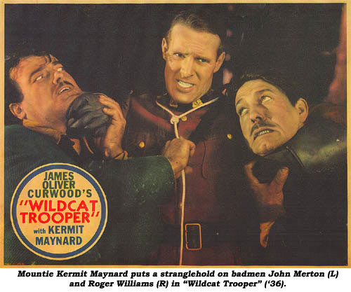 Mountie Kermit Maynard puts a stranglehold on badmen John Merton (L) and Roger Williams (R) in "Wildcat Trooper" ('36).