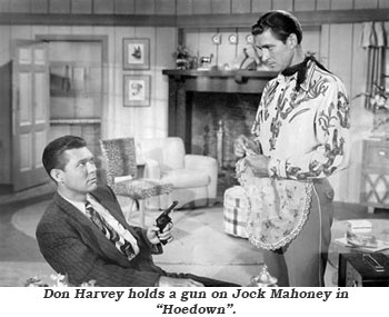 Don Harvey holds a gun on Jock Mahoney in "Hoedown".