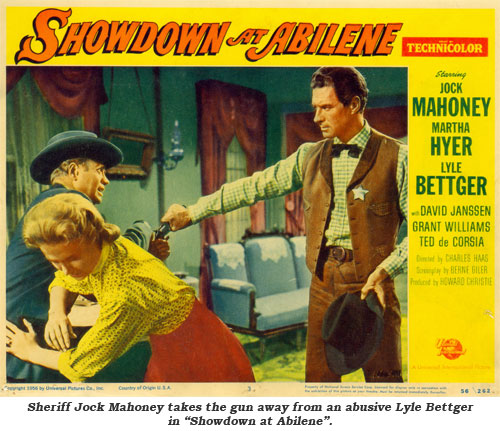 Sheriff Jock Mahoney takes the gun away from an abusive Lyle Bettger in "Showdown at Abilene".